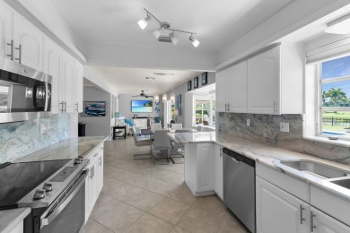 IT IS ALL ABOUT THE LOCATION. This home sits on a lake looking on Island Country Club in Florida - for sale on GolfHomes.com, golf home, golf lot