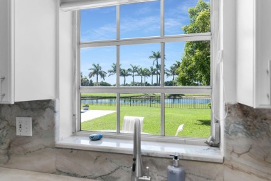 IT IS ALL ABOUT THE LOCATION. This home sits on a lake looking on Island Country Club in Florida - for sale on GolfHomes.com, golf home, golf lot