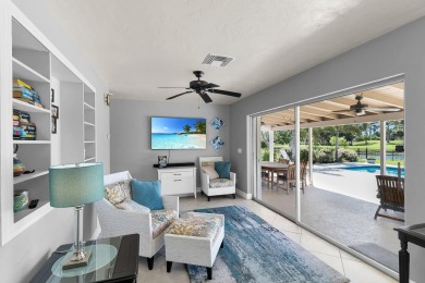IT IS ALL ABOUT THE LOCATION. This home sits on a lake looking on Island Country Club in Florida - for sale on GolfHomes.com, golf home, golf lot