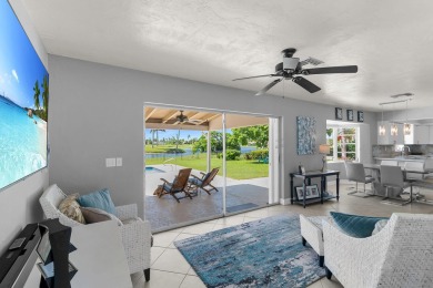 IT IS ALL ABOUT THE LOCATION. This home sits on a lake looking on Island Country Club in Florida - for sale on GolfHomes.com, golf home, golf lot