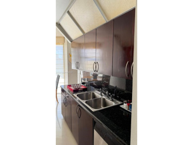 Experience luxury living in this stunning 2-bedroom, 2-bath on Turnberry Isle Resort and Club in Florida - for sale on GolfHomes.com, golf home, golf lot
