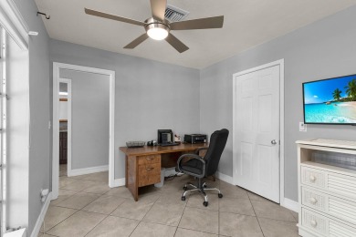 IT IS ALL ABOUT THE LOCATION. This home sits on a lake looking on Island Country Club in Florida - for sale on GolfHomes.com, golf home, golf lot