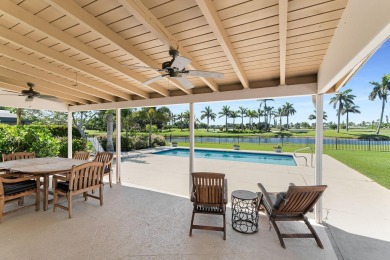 IT IS ALL ABOUT THE LOCATION. This home sits on a lake looking on Island Country Club in Florida - for sale on GolfHomes.com, golf home, golf lot