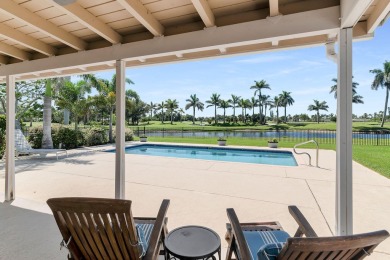 IT IS ALL ABOUT THE LOCATION. This home sits on a lake looking on Island Country Club in Florida - for sale on GolfHomes.com, golf home, golf lot