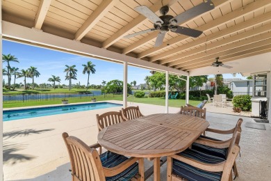IT IS ALL ABOUT THE LOCATION. This home sits on a lake looking on Island Country Club in Florida - for sale on GolfHomes.com, golf home, golf lot