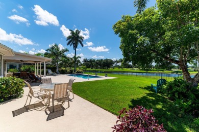 IT IS ALL ABOUT THE LOCATION. This home sits on a lake looking on Island Country Club in Florida - for sale on GolfHomes.com, golf home, golf lot