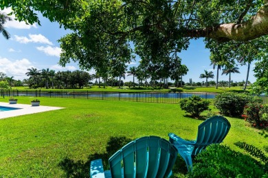 IT IS ALL ABOUT THE LOCATION. This home sits on a lake looking on Island Country Club in Florida - for sale on GolfHomes.com, golf home, golf lot