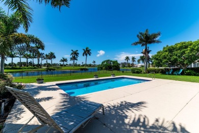 IT IS ALL ABOUT THE LOCATION. This home sits on a lake looking on Island Country Club in Florida - for sale on GolfHomes.com, golf home, golf lot