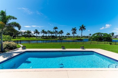 IT IS ALL ABOUT THE LOCATION. This home sits on a lake looking on Island Country Club in Florida - for sale on GolfHomes.com, golf home, golf lot