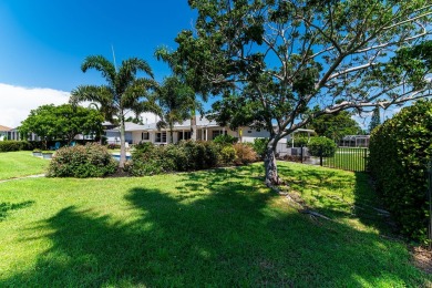 IT IS ALL ABOUT THE LOCATION. This home sits on a lake looking on Island Country Club in Florida - for sale on GolfHomes.com, golf home, golf lot