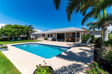 IT IS ALL ABOUT THE LOCATION. This home sits on a lake looking on Island Country Club in Florida - for sale on GolfHomes.com, golf home, golf lot