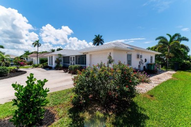 IT IS ALL ABOUT THE LOCATION. This home sits on a lake looking on Island Country Club in Florida - for sale on GolfHomes.com, golf home, golf lot