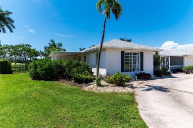 IT IS ALL ABOUT THE LOCATION. This home sits on a lake looking on Island Country Club in Florida - for sale on GolfHomes.com, golf home, golf lot
