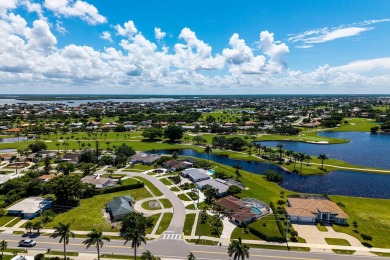 IT IS ALL ABOUT THE LOCATION. This home sits on a lake looking on Island Country Club in Florida - for sale on GolfHomes.com, golf home, golf lot