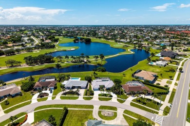 IT IS ALL ABOUT THE LOCATION. This home sits on a lake looking on Island Country Club in Florida - for sale on GolfHomes.com, golf home, golf lot
