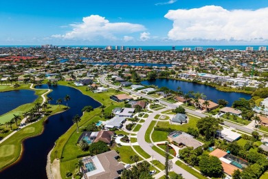 IT IS ALL ABOUT THE LOCATION. This home sits on a lake looking on Island Country Club in Florida - for sale on GolfHomes.com, golf home, golf lot