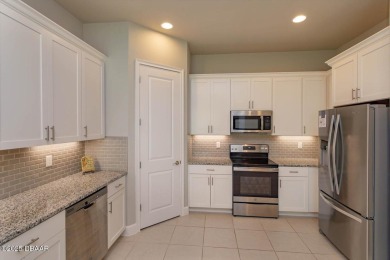This end-unit townhome located in the highly sought after on Plantation Bay Golf and Country Club in Florida - for sale on GolfHomes.com, golf home, golf lot