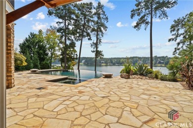 Discover luxurious lakefront living with this stunning custom on Reynolds Lake Oconee - The Oconee in Georgia - for sale on GolfHomes.com, golf home, golf lot