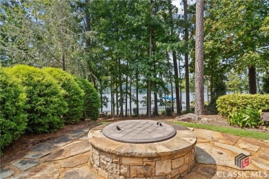 Discover luxurious lakefront living with this stunning custom on Reynolds Lake Oconee - The Oconee in Georgia - for sale on GolfHomes.com, golf home, golf lot