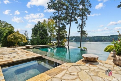 Discover luxurious lakefront living with this stunning custom on Reynolds Lake Oconee - The Oconee in Georgia - for sale on GolfHomes.com, golf home, golf lot