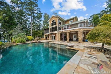 Discover luxurious lakefront living with this stunning custom on Reynolds Lake Oconee - The Oconee in Georgia - for sale on GolfHomes.com, golf home, golf lot