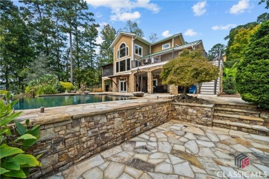 Discover luxurious lakefront living with this stunning custom on Reynolds Lake Oconee - The Oconee in Georgia - for sale on GolfHomes.com, golf home, golf lot