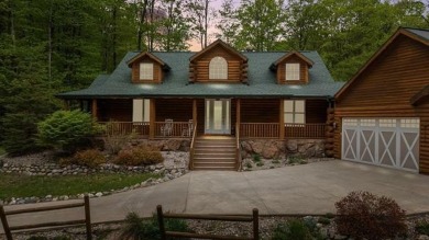 Stunning, custom-built log home overlooking the 16th tee & on Cedar River Golf Course in Michigan - for sale on GolfHomes.com, golf home, golf lot