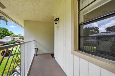 Elegant Country Club Living - Spacious 2-Bedroom + Den with Lake on Hunters Run Golf and Country Club in Florida - for sale on GolfHomes.com, golf home, golf lot