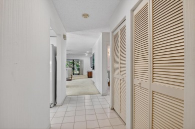 Elegant Country Club Living - Spacious 2-Bedroom + Den with Lake on Hunters Run Golf and Country Club in Florida - for sale on GolfHomes.com, golf home, golf lot