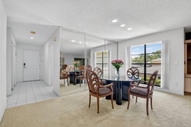 Elegant Country Club Living - Spacious 2-Bedroom + Den with Lake on Hunters Run Golf and Country Club in Florida - for sale on GolfHomes.com, golf home, golf lot