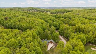 Stunning, custom-built log home overlooking the 16th tee & on Cedar River Golf Course in Michigan - for sale on GolfHomes.com, golf home, golf lot