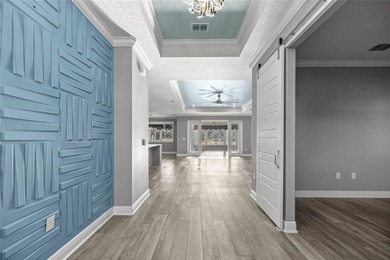 GOLF COURSE VIEW! WHOLE HOUSE GENERATOR! SOLAR TUBES! ENCLOSED on  in Florida - for sale on GolfHomes.com, golf home, golf lot