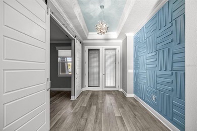 GOLF COURSE VIEW! WHOLE HOUSE GENERATOR! SOLAR TUBES! ENCLOSED on  in Florida - for sale on GolfHomes.com, golf home, golf lot