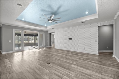 GOLF COURSE VIEW! WHOLE HOUSE GENERATOR! SOLAR TUBES! ENCLOSED on  in Florida - for sale on GolfHomes.com, golf home, golf lot