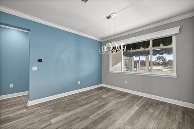 GOLF COURSE VIEW! WHOLE HOUSE GENERATOR! SOLAR TUBES! ENCLOSED on  in Florida - for sale on GolfHomes.com, golf home, golf lot