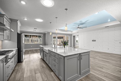 GOLF COURSE VIEW! WHOLE HOUSE GENERATOR! SOLAR TUBES! ENCLOSED on  in Florida - for sale on GolfHomes.com, golf home, golf lot