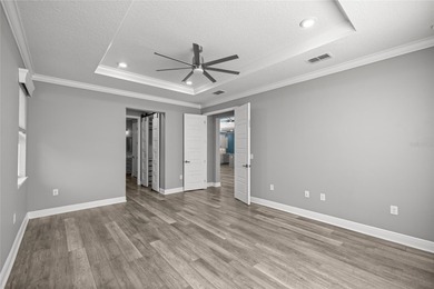 GOLF COURSE VIEW! WHOLE HOUSE GENERATOR! SOLAR TUBES! ENCLOSED on  in Florida - for sale on GolfHomes.com, golf home, golf lot