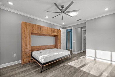 GOLF COURSE VIEW! WHOLE HOUSE GENERATOR! SOLAR TUBES! ENCLOSED on  in Florida - for sale on GolfHomes.com, golf home, golf lot