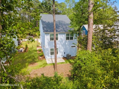 Welcome to your own modern, coastal retreat at 1163 N. Caswell on The Lakes Country Club in North Carolina - for sale on GolfHomes.com, golf home, golf lot