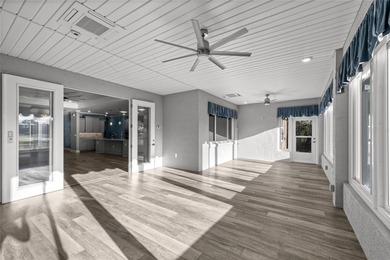 GOLF COURSE VIEW! WHOLE HOUSE GENERATOR! SOLAR TUBES! ENCLOSED on  in Florida - for sale on GolfHomes.com, golf home, golf lot