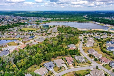 This quaint 2271 sq ft, 4 bedrooms, 2 bath, Logan home is on Compass Pointe Golf Course in North Carolina - for sale on GolfHomes.com, golf home, golf lot