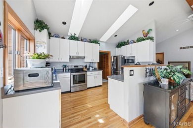 Lake life is calling--and this one answers in style! This on Raintree Country Club in Missouri - for sale on GolfHomes.com, golf home, golf lot