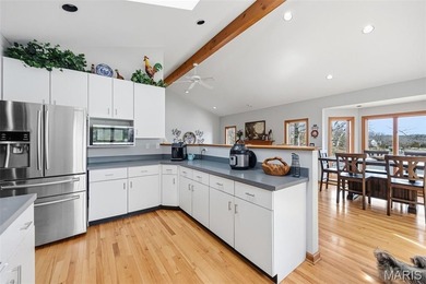 Lake life is calling--and this one answers in style! This on Raintree Country Club in Missouri - for sale on GolfHomes.com, golf home, golf lot