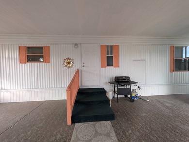 Before I forget to say it,  the GOLF CART comes with the home! on Grasslands Golf and Country Club in Florida - for sale on GolfHomes.com, golf home, golf lot