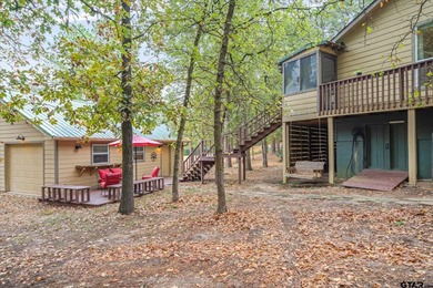 An absolute 3/3/2+ dream home in highly sought after gated on Holly Lake Ranch Golf Club in Texas - for sale on GolfHomes.com, golf home, golf lot