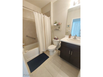 Welcome to your lakeview villa with attached garage & golf cart on Herons Glen Golf and Country Club in Florida - for sale on GolfHomes.com, golf home, golf lot