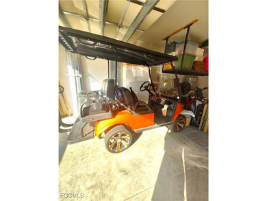 Welcome to your lakeview villa with attached garage & golf cart on Herons Glen Golf and Country Club in Florida - for sale on GolfHomes.com, golf home, golf lot