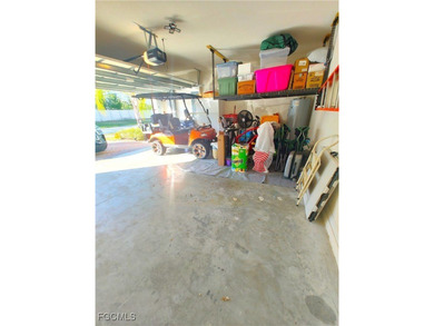 Welcome to your lakeview villa with attached garage & golf cart on Herons Glen Golf and Country Club in Florida - for sale on GolfHomes.com, golf home, golf lot