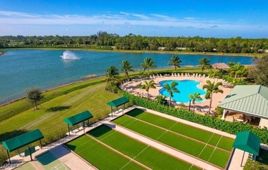 Welcome to your lakeview villa with attached garage & golf cart on Herons Glen Golf and Country Club in Florida - for sale on GolfHomes.com, golf home, golf lot