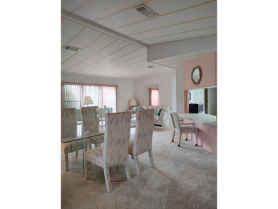 Spacious two-bedroom, two-bath home located in the gated golf on Lake Fairways Country Club in Florida - for sale on GolfHomes.com, golf home, golf lot